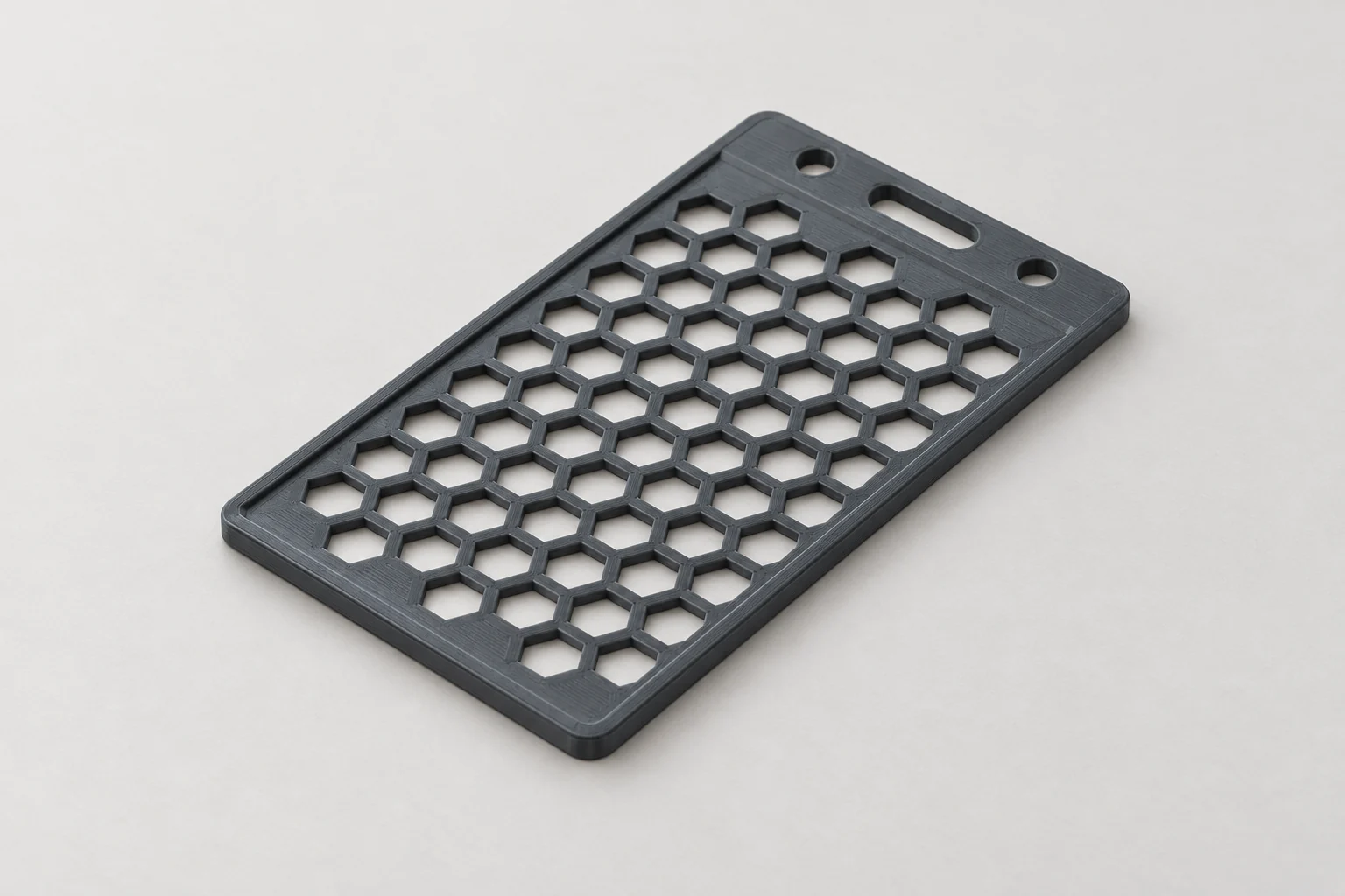 Model-based studio visualization of slim ID Card Holder in charcoal-gray printed plastic.
