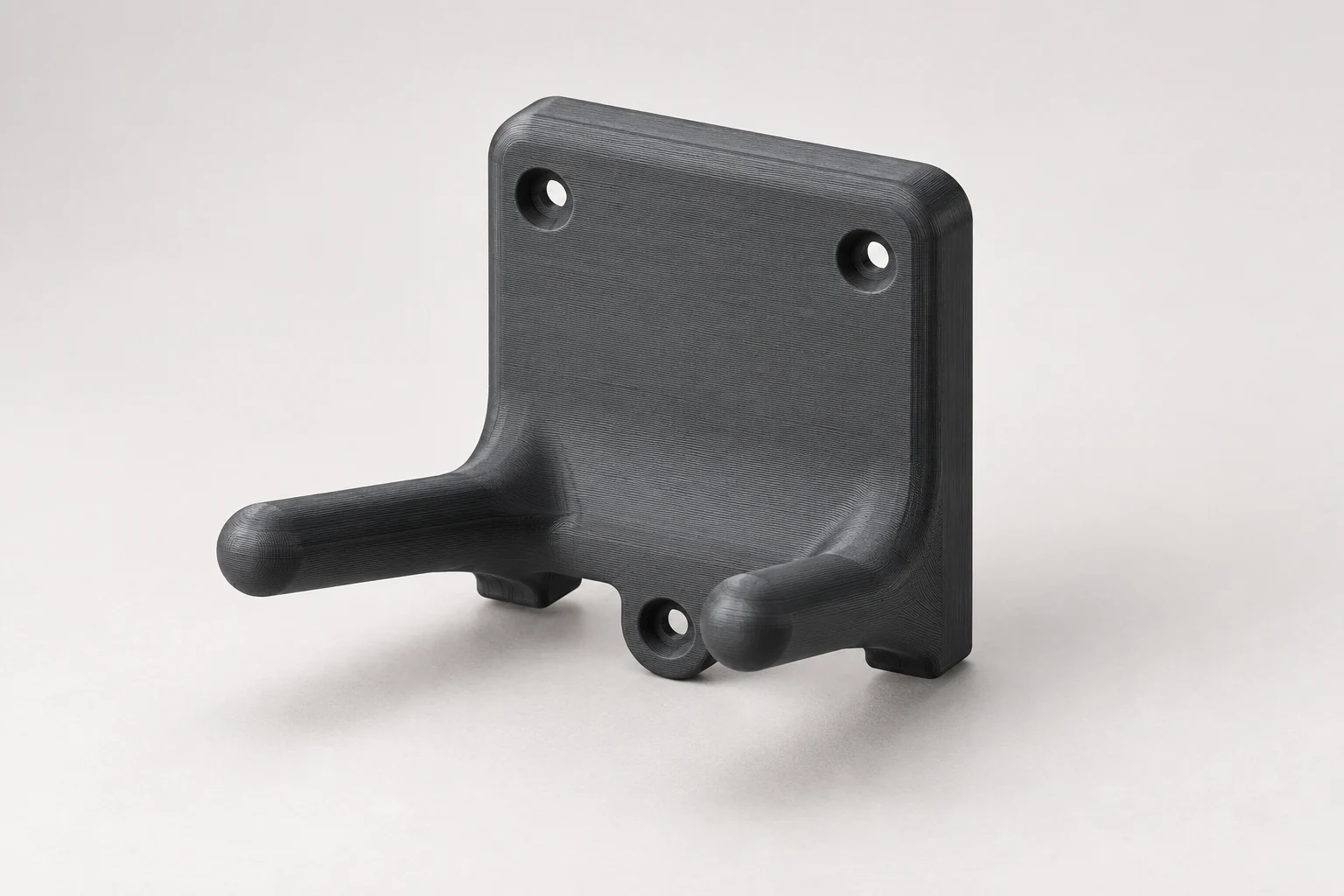 Model-based studio visualization of tool Mount for Milwaukee M18 Grinder in charcoal-gray printed plastic.