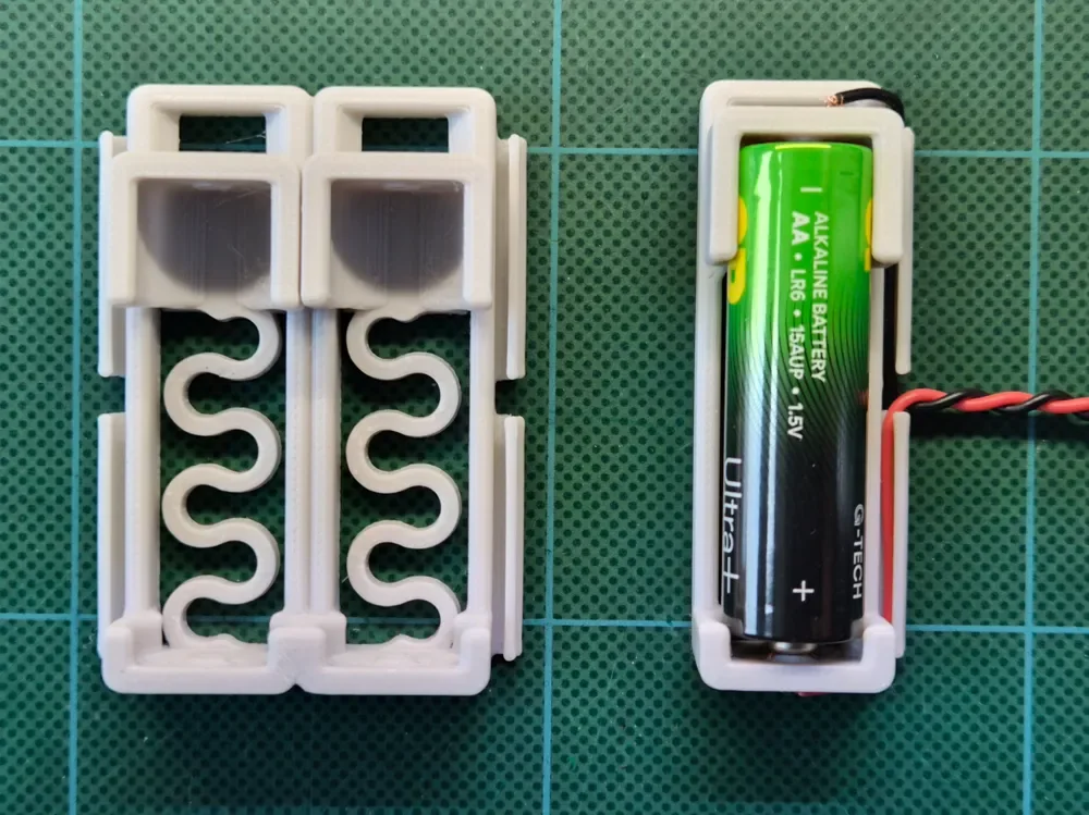 Creator design reference for AA Battery Holder — Four Cell; included printed parts are specified in the listing.